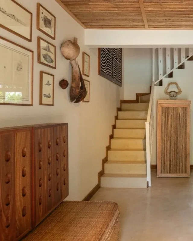 In the living room, modern comforts stay discreet -the TV and fridge hidden in wood so nothing distracts from the beauty of the objects and antiques around you. 🦤

#MaisonTropical #Mauritius #AntiqueLovers #CuratedSpaces #DesignDetails
#BoutiqueRetreat #IslandDesign #TropicalDecor #VintageStyle #CollectedInteriors