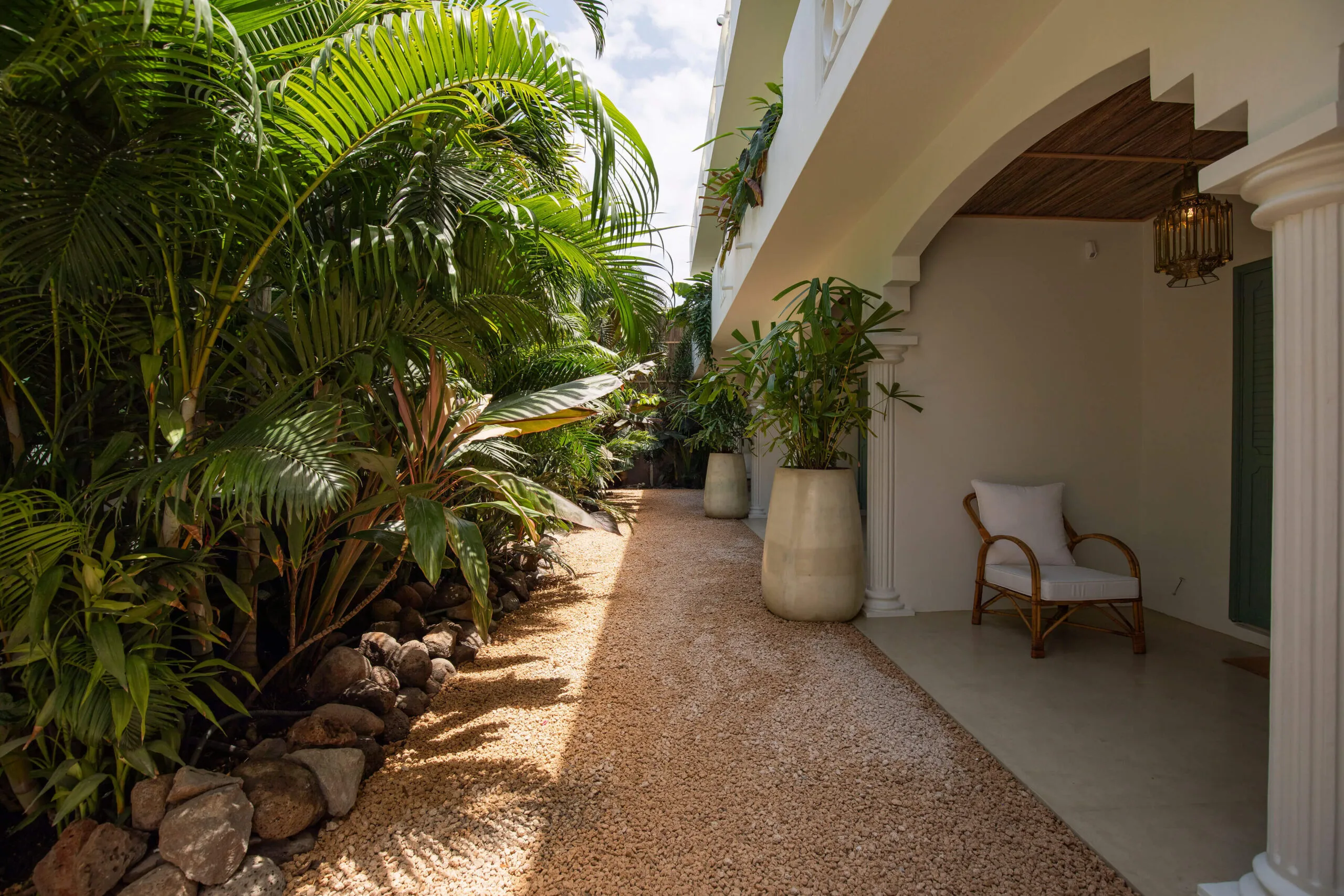 Each suite faces the garden, with a terrace set within lush greenery.
